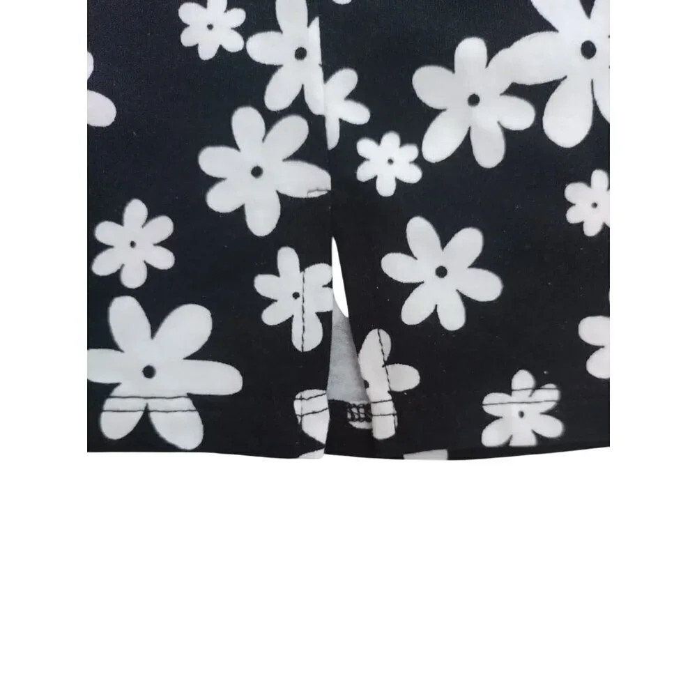 art class. Girls black and white floral print dress and white shirt sleeve. NWT